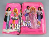 two boxes of barbie dolls are sitting on a table