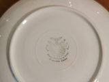 a white plate with an eagle on it sitting on a table