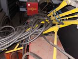 a pile of wires and other equipment in a garage