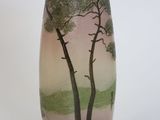 a vase with a picture of a tree on it