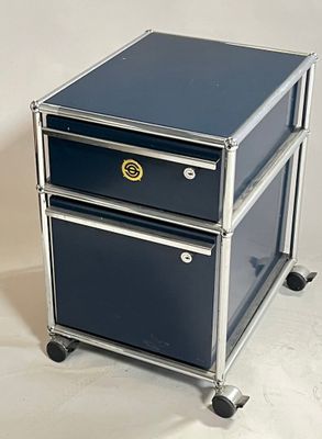 two drawers that are on wheels on a white surface