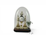 a glass dome with a clock inside of it