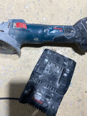 a tool that is sitting on the floor next to a piece of paper