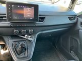 the interior of a car with a steering control and dashboard controls