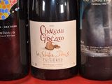 several bottles of wine are lined up on a table