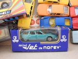 many toy cars that are in a box on the floor