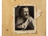 an old picture of a man holding a piece of paper in his hand