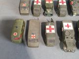 several toy army vehicles are lined up in a row on a table
