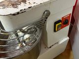 a mixer that is sitting on the floor next to a box