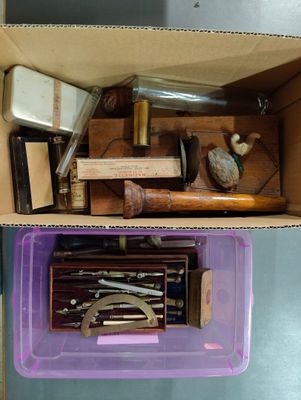 a purple box filled with assorted items sitting on a table