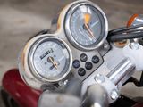 a close up of a motorcycle with a speedometer and gauges on it