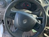 dashboard of a small car with a steering wheel and dashboard controls
