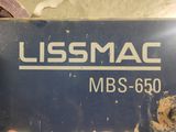 un panneau bleu sur lequel est inscrit « USS Mac »