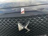 a close up of the front of a car with a logo on it
