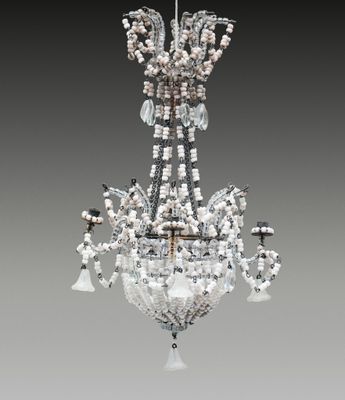 a crystal chandelier hanging from a ceiling in a room
