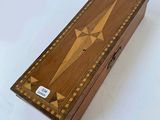 an image of a wooden box with a star design on it