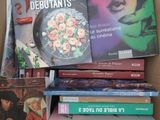 many books in a cardboard box on the table