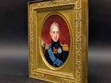 an antique portrait of a man in uniform in a gold frame