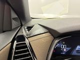 the dashboard of a car with a digital display in the center