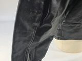 a close up of a pair of black leather boots on a mannequin base