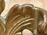 a close up of a gold statue of a horse