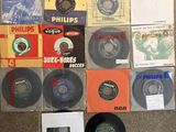various records are arranged on the floor in a pile
