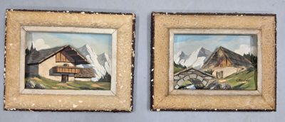 Deux tableaux représentant une maison et une montagne sont accrochés au mur.