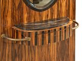 a wooden clock with a mirror on the top of it