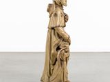 an image of a statue of a woman holding a child