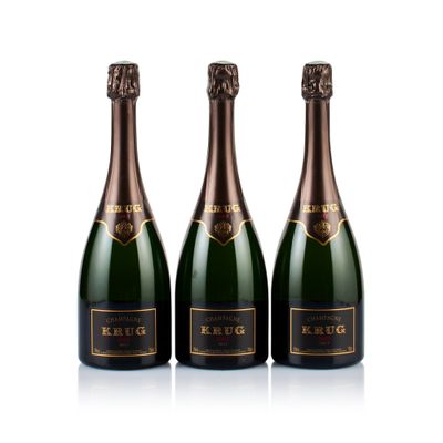 three bottles of champagne in a row on a white background