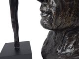 statue of a man holding a woman ' s head with both hands