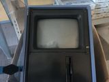 a small television sitting in a box in a store