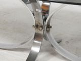 an image of a glass table with a metal base