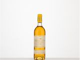 a bottle of white wine sitting on top of a table