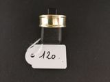 a close up of a small bottle with a tag on it