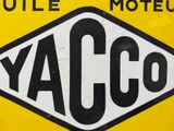 a yellow and black sign that says yacco on it