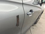 a close up of a car door with a sticker on it