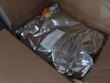 a cardboard box with a bag of food inside of it