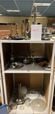 a cabinet with pots and pans on top of it