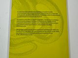 the back cover of a yellow book with a snake on it