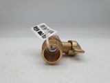 a close up of a brass fire hydrant on a white surface