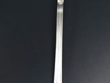 a spoon that is sitting on a black table