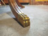a close up view of a wooden table with a metal handle