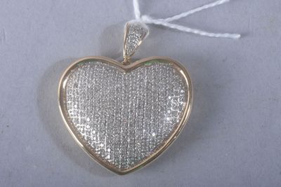 a close up of a silver heart shaped locke with a rope