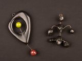 two different types of fishing lures on a black surface