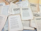 a pile of old books sitting on a table