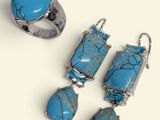 three pieces of jewelry including a turquoise stone ring, earrings, and ring