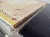 a book sitting on top of a table next to a cell phone