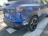a blue car parked on the side of the road
