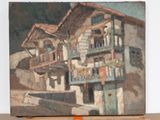a painting of a house on a easel on a table